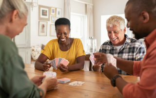 Oakleigh of Macomb Senior Living Group of seniors playing cards