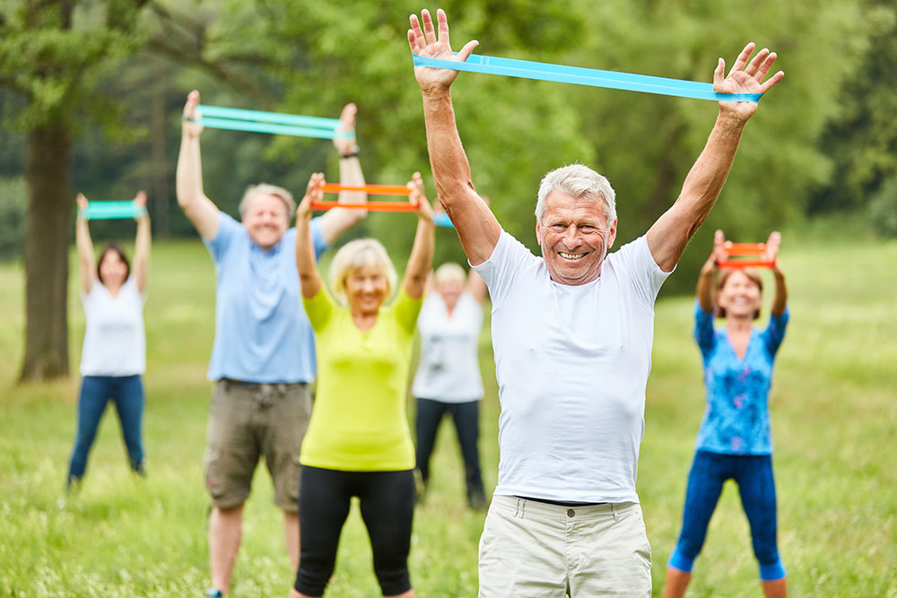 Oakleigh of Macomb Senior Living seniors exercising outside social distancing