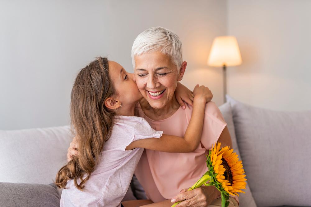 A senior woman and her granddaughter