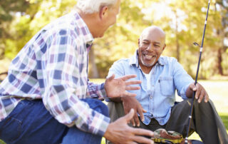 Senior friends fishing together