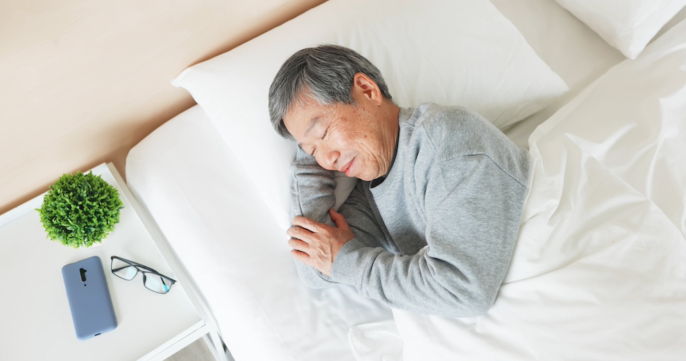 An older adult man getting quality rest at the senior living apartments in Macomb