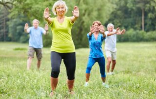 A group of seniors practicing Tai Chi at the senior living apartments in Macomb